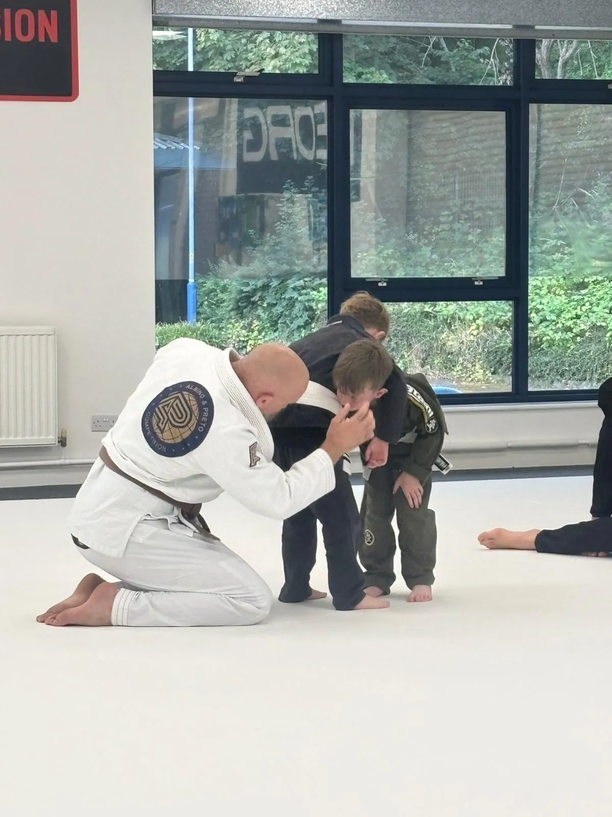 Martial arts instructor teaching young students.