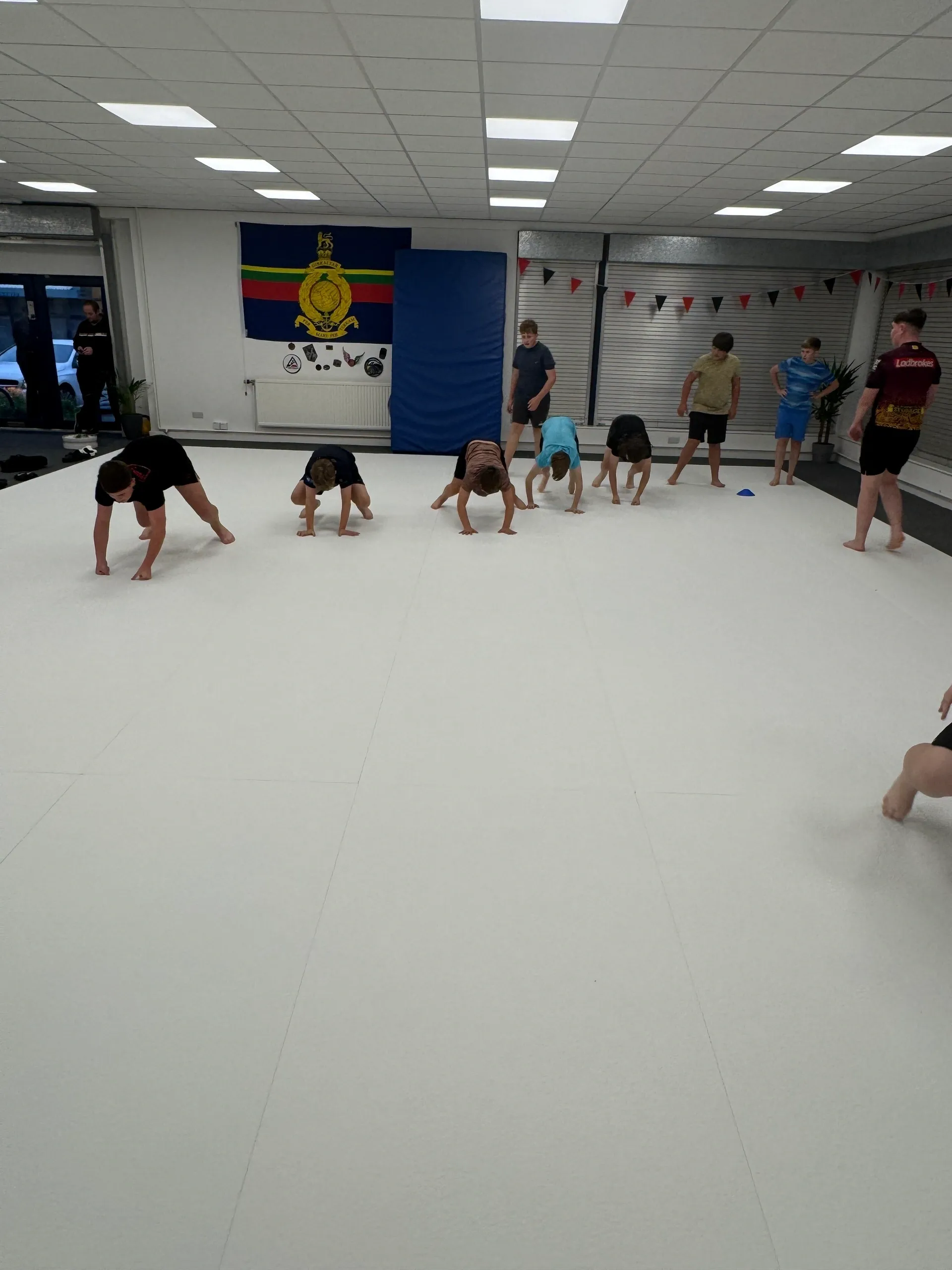 Kids exercising in a martial arts class.