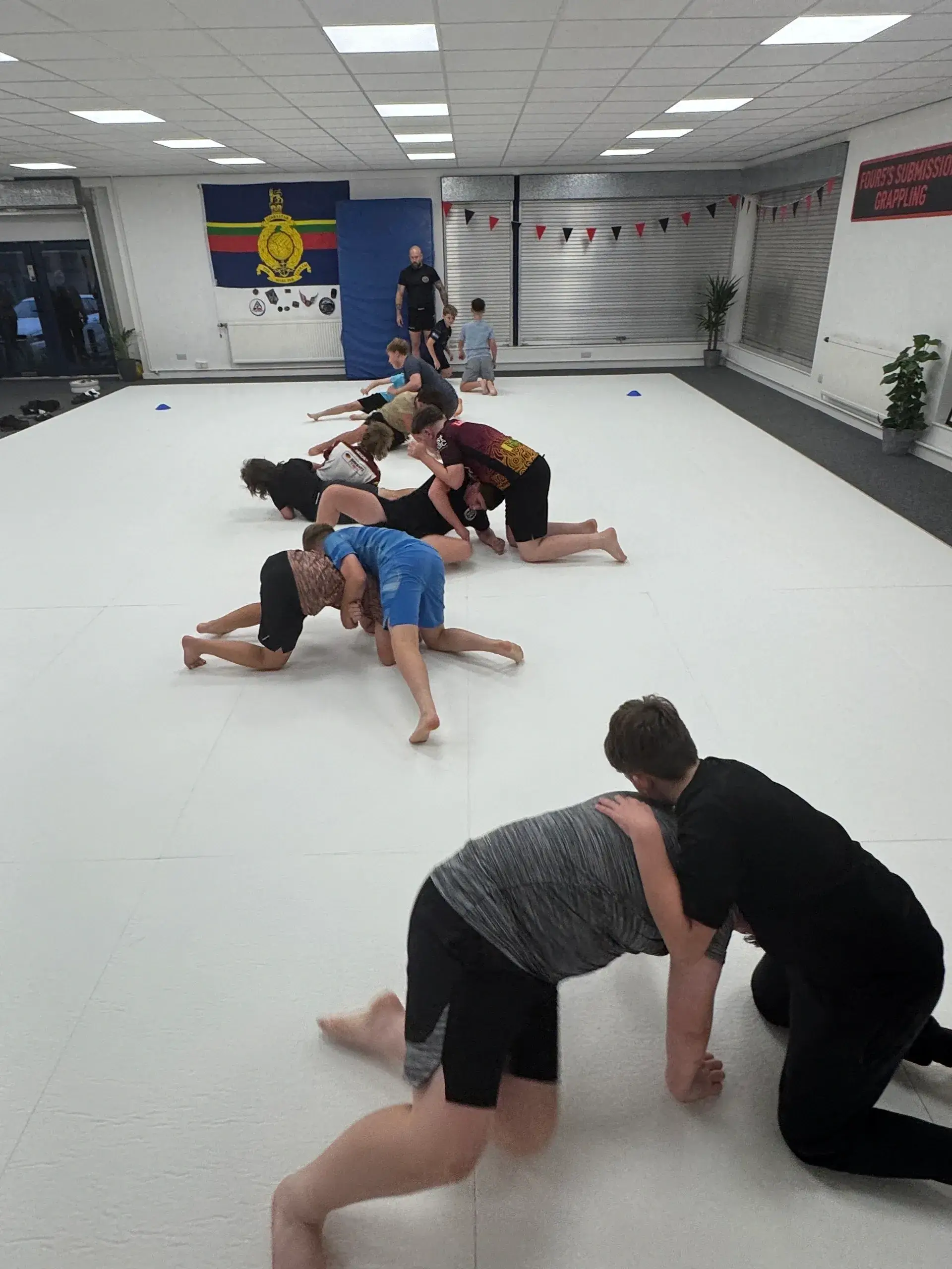 People practicing martial arts in a dojo.