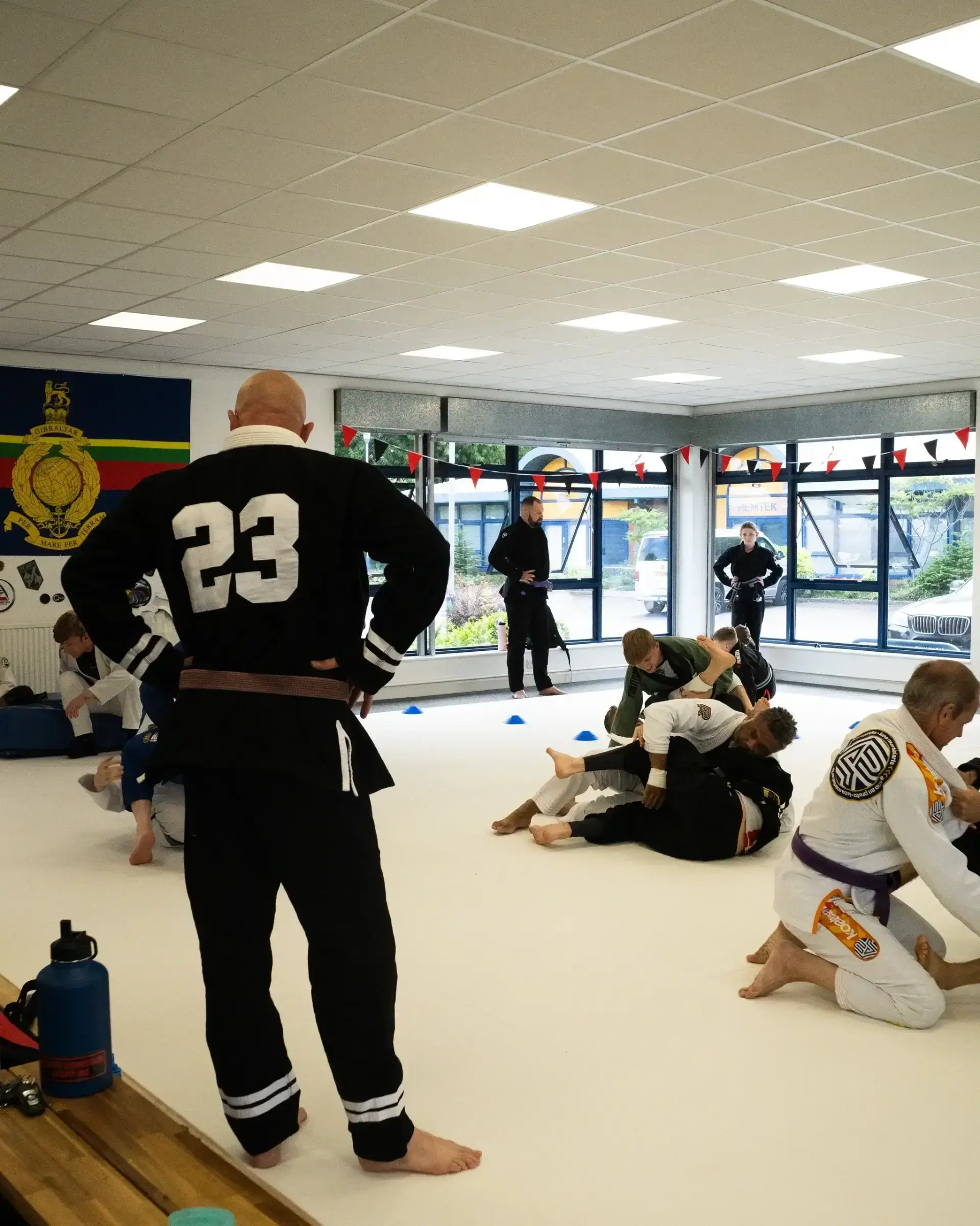 Martial arts class with students sparring.